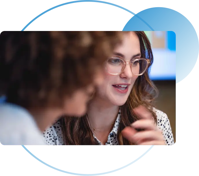 Colleagues discussing compliance plans